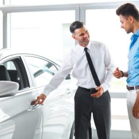 Car Dealership and Buyer Looking a Car.