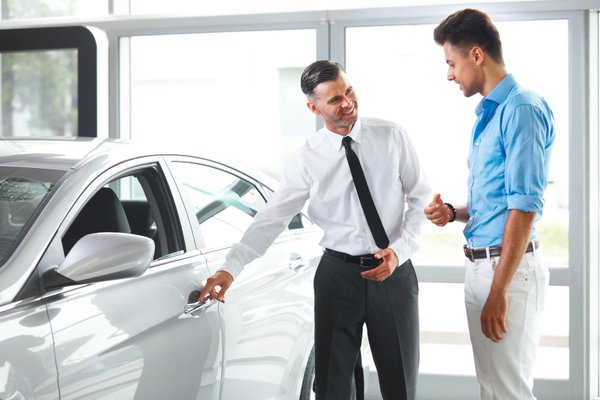 Car Dealership and Buyer Looking a Car.
